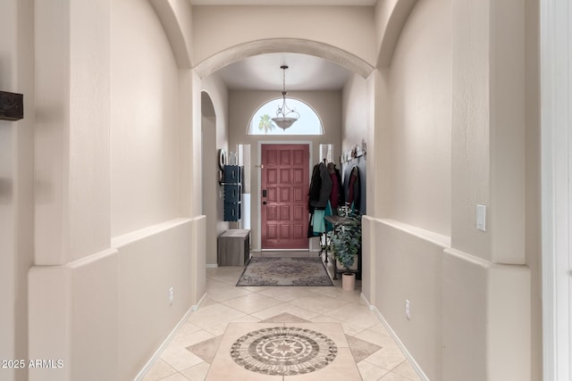 foyer entrance with light tile patterned floors