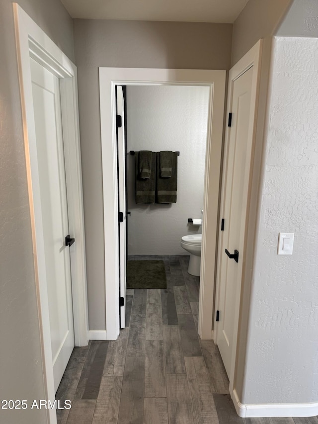 hallway with dark wood-type flooring