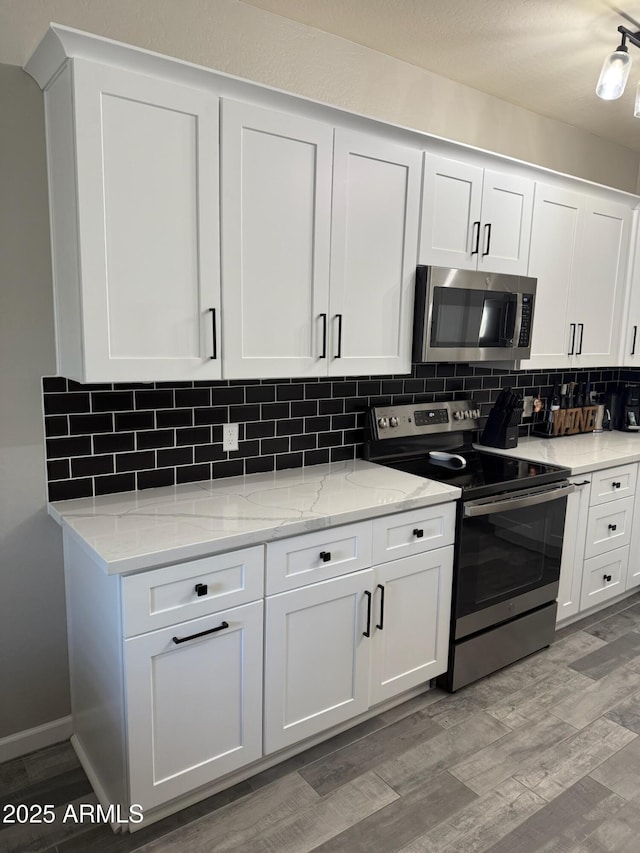 kitchen featuring white cabinetry and stainless steel appliances