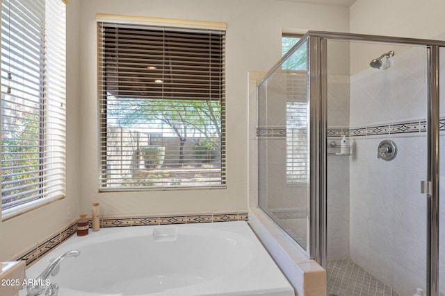 bathroom with shower with separate bathtub