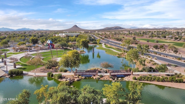 birds eye view of property with a water and mountain view