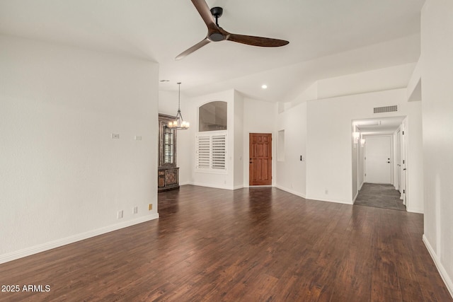 19812 N 90th Dr, Peoria, AZ 85382 - unfurnished living room featuring dark wood-style floors, visible vents, baseboards, lofted ceiling, and ceiling fan with notable chandelier