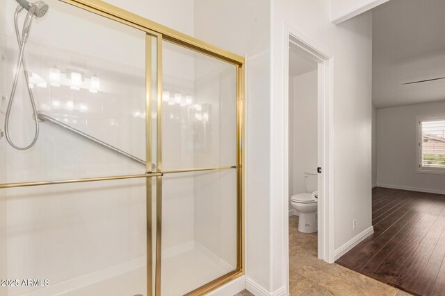 19812 N 90th Dr, Peoria, AZ 85382 - bathroom with toilet, a shower stall, and baseboards