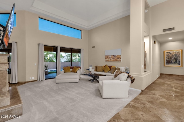 living room featuring a high ceiling