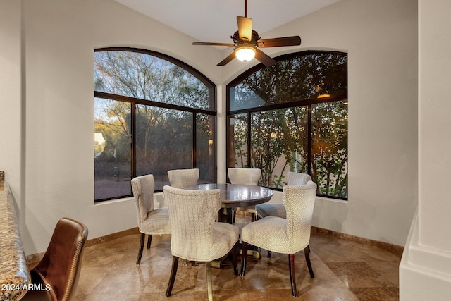 interior space with ceiling fan and vaulted ceiling