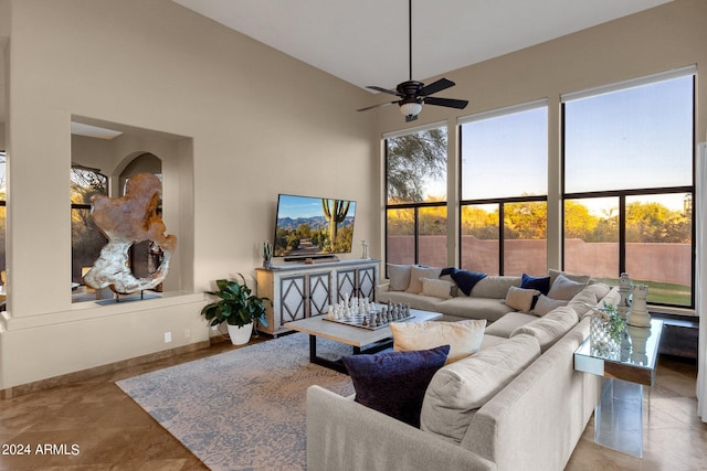 living room with tile patterned floors and ceiling fan