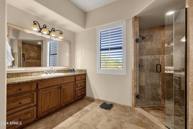 bathroom with vanity and an enclosed shower