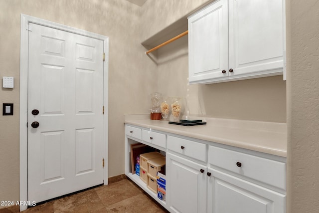 interior space featuring white cabinetry