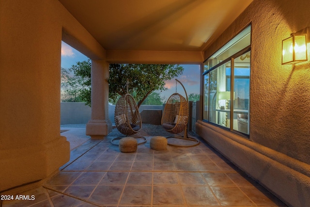 view of patio terrace at dusk