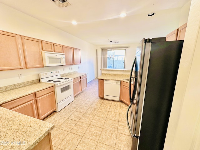 kitchen with pendant lighting, a notable chandelier, light brown cabinets, and white appliances