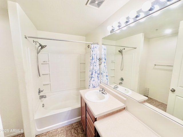 bathroom with shower / tub combo with curtain and vanity