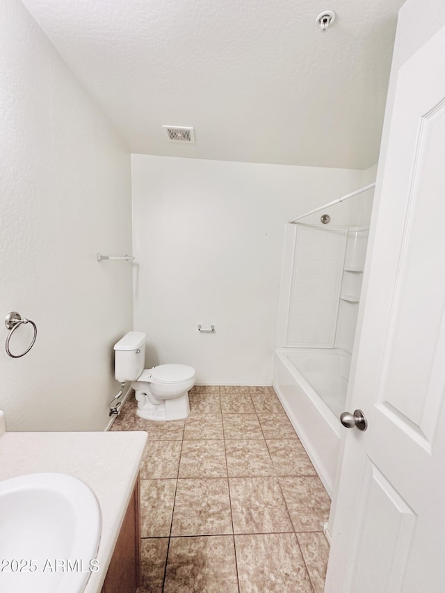 full bathroom with tile patterned floors, vanity, a textured ceiling, shower / tub combination, and toilet