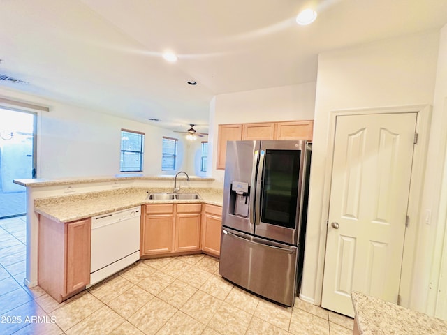 kitchen featuring light brown cabinets, white dishwasher, sink, ceiling fan, and stainless steel fridge with ice dispenser