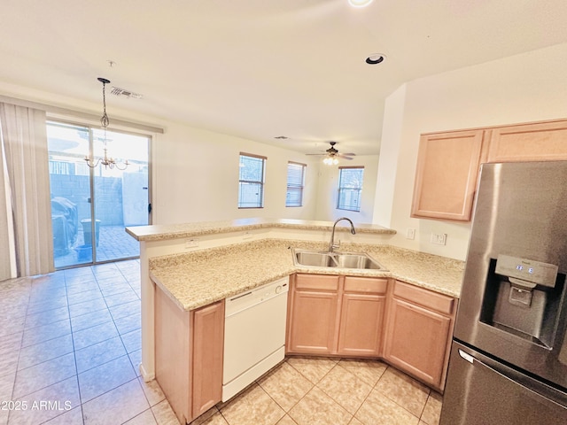 kitchen featuring kitchen peninsula, light brown cabinetry, white dishwasher, sink, and stainless steel fridge with ice dispenser