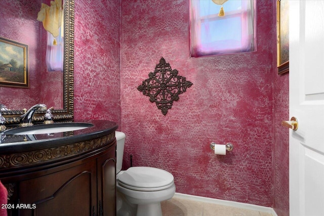 bathroom with vanity, toilet, and tile patterned flooring