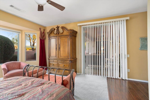 bedroom featuring ceiling fan and dark hardwood / wood-style flooring