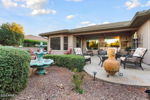 rear view of house featuring an outdoor hangout area and a patio area