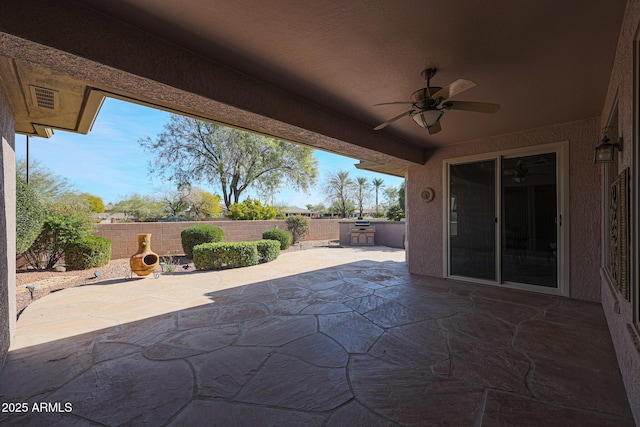 view of patio / terrace with area for grilling and ceiling fan