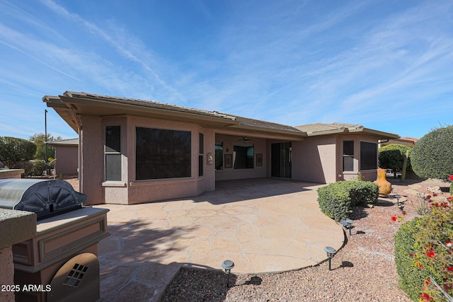 rear view of property featuring a patio