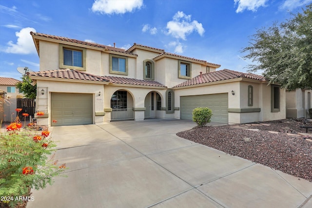 mediterranean / spanish-style home featuring a garage