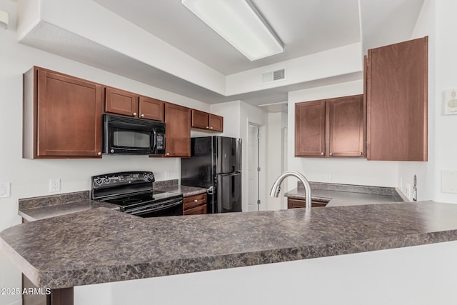 1100 N Priest Dr Unit 2145, Chandler, AZ 85226 - kitchen featuring a peninsula, dark countertops, black appliances, and visible vents
