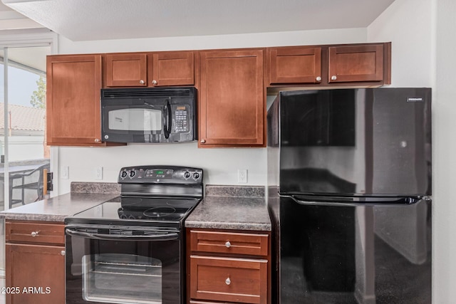 1100 N Priest Dr Unit 2145, Chandler, AZ 85226 - kitchen featuring brown cabinets, dark countertops, and black appliances