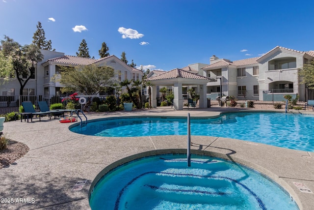 1100 N Priest Dr Unit 2145, Chandler, AZ 85226 - community pool with fence, a gazebo, a hot tub, and a patio area