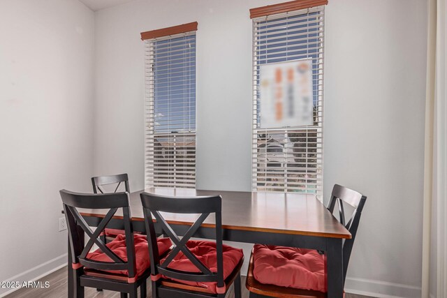 1100 N Priest Dr Unit 2145, Chandler, AZ 85226 - dining room featuring baseboards and wood finished floors