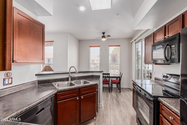1100 N Priest Dr Unit 2145, Chandler, AZ 85226 - kitchen featuring a sink, light wood-type flooring, dark countertops, black appliances, and ceiling fan
