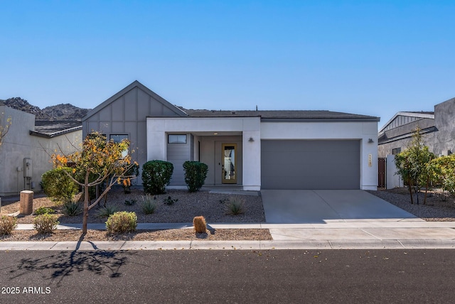 view of front facade with a mountain view and a garage