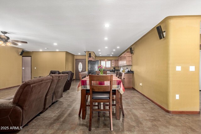 dining room with baseboards, a ceiling fan, and recessed lighting