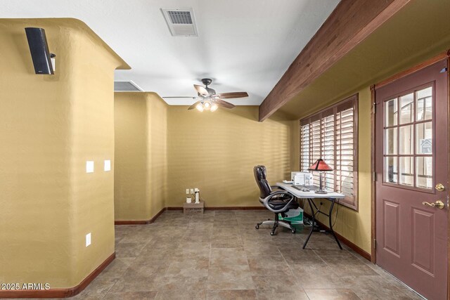 office space with a ceiling fan, beam ceiling, visible vents, and baseboards