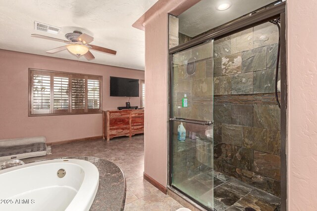 full bathroom featuring a stall shower, baseboards, visible vents, and a bath