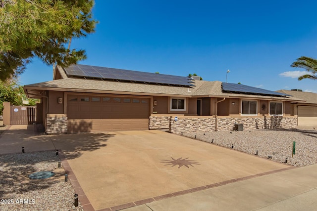 single story home featuring a garage, stone siding, concrete driveway, and stucco siding