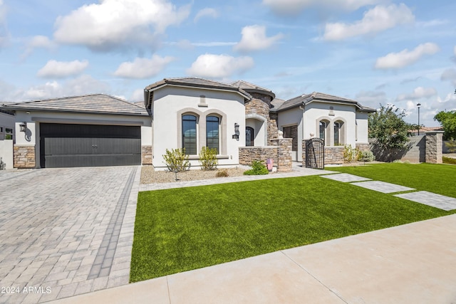 view of front facade with a front lawn and a garage