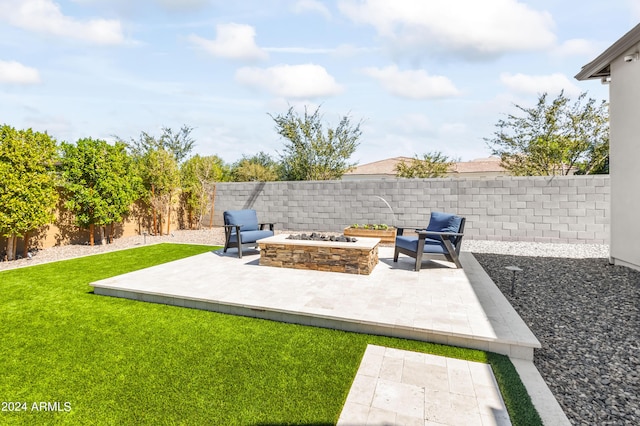 view of yard featuring a patio and an outdoor fire pit