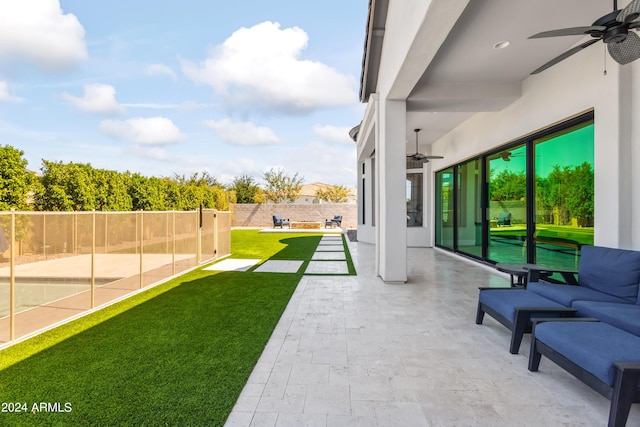 view of patio / terrace featuring ceiling fan