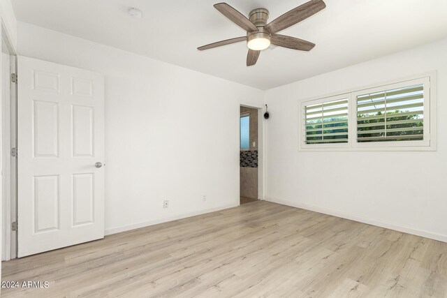 unfurnished room with ceiling fan and light hardwood / wood-style floors