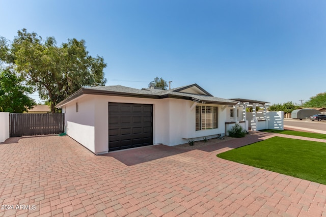 ranch-style home featuring a garage