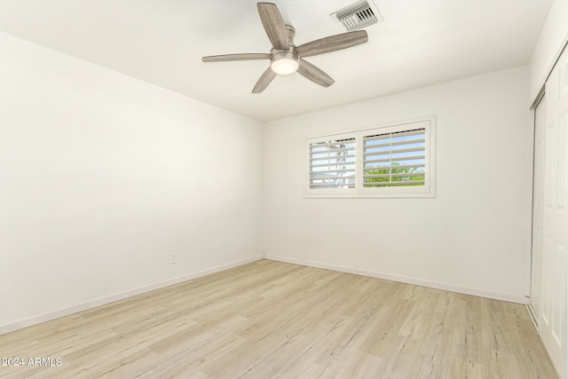 unfurnished room featuring ceiling fan and light hardwood / wood-style floors