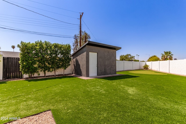 view of yard with a storage unit