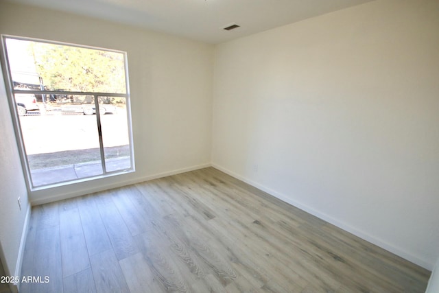 unfurnished room featuring light wood-type flooring