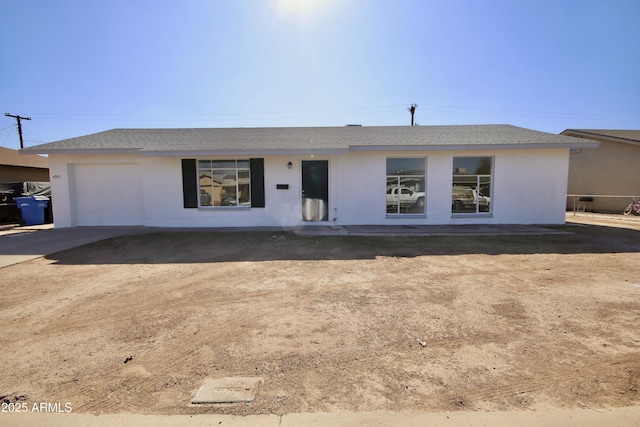 ranch-style home featuring a garage