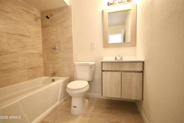 full bathroom featuring vanity, toilet, and tiled shower / bath combo