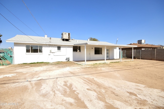 rear view of property with a patio and central air condition unit