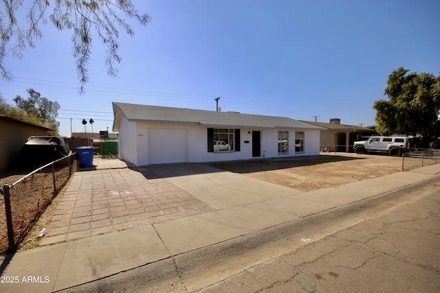 ranch-style house featuring a garage