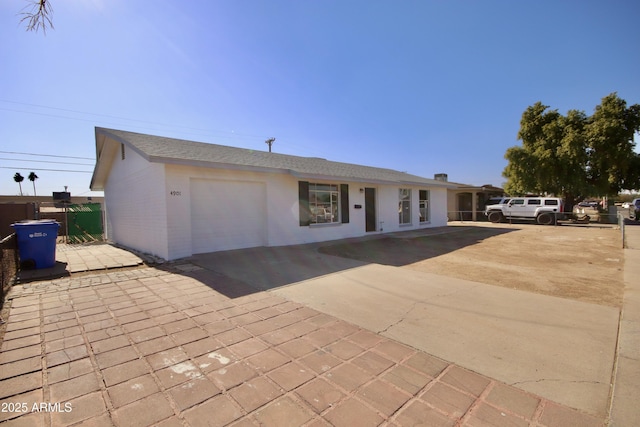 ranch-style home featuring a garage