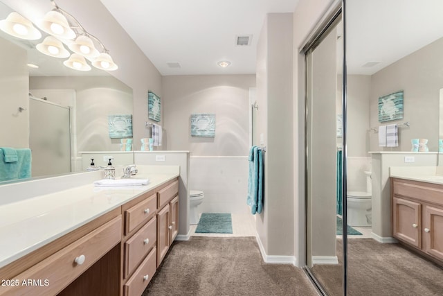 full bathroom featuring visible vents, carpet flooring, toilet, and a shower stall