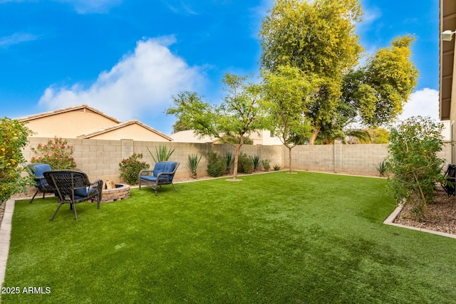 view of yard with a fire pit