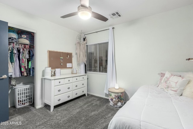 carpeted bedroom with ceiling fan and a closet